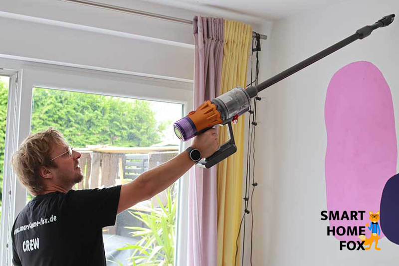 Dyson V12 Slim as a cordless hand-held vacuum cleaner on the ceiling